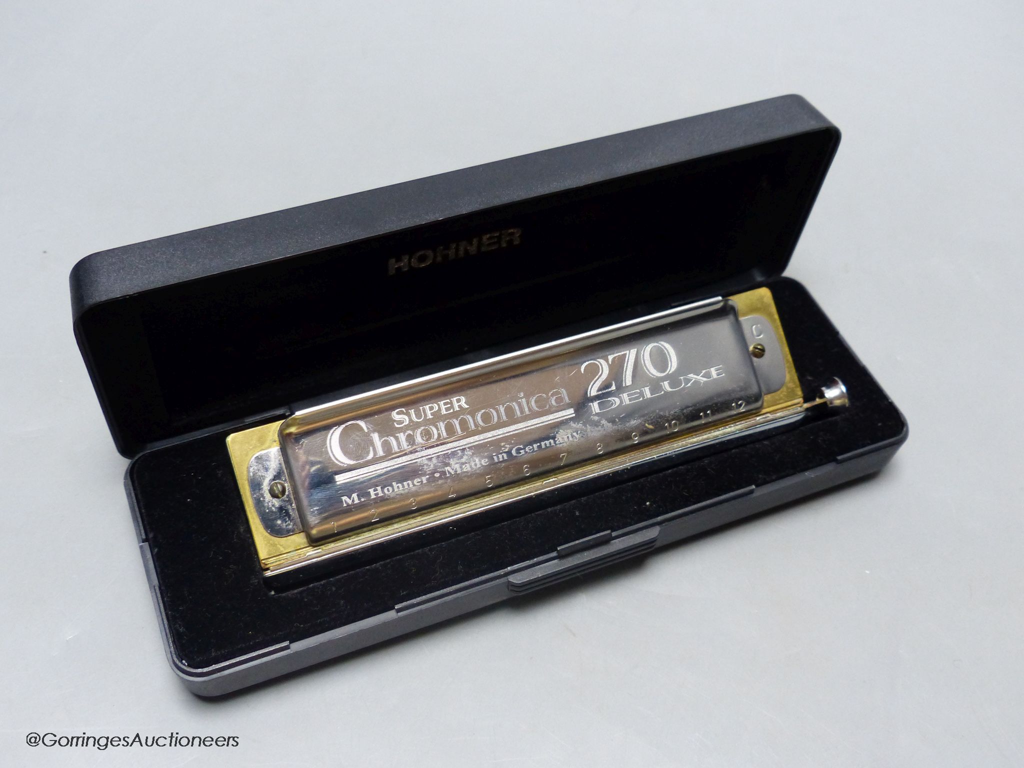 An M.Hohner Super Chromatica 270 deluxe Harmonica, cased